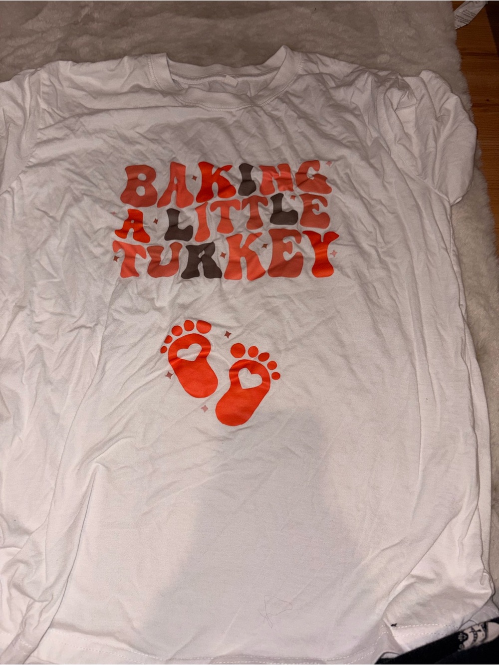 White Graphic Tee with Orange 'Baking a Little Turkey' Design
